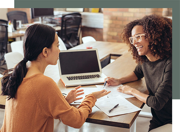 an image of two women going over finances